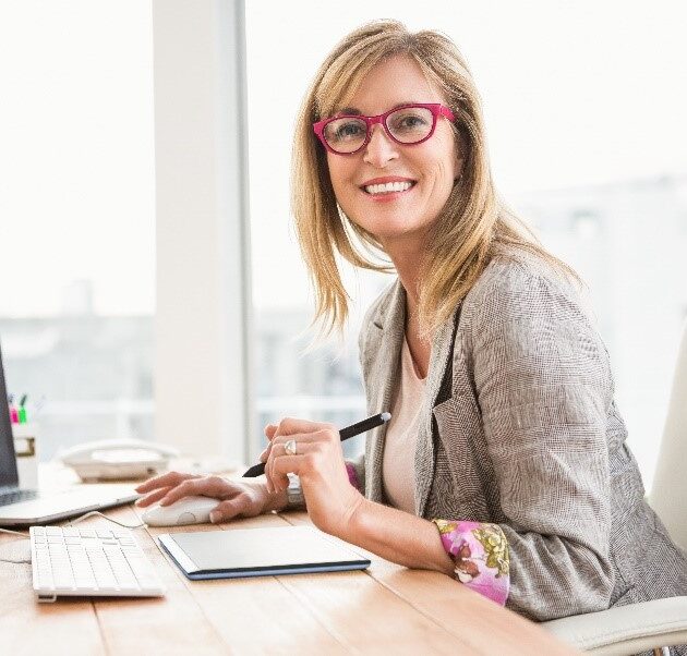 Business Woman Sitting at Desk