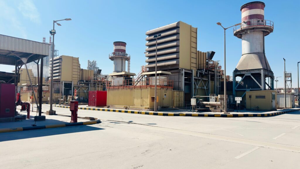 The turbine hall, stack and switchyard of a gas-fired power station